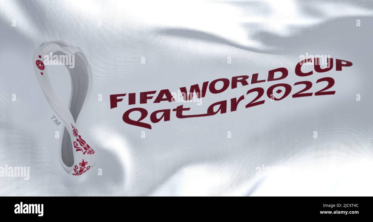 Doha, Qatar, October 2021: Flag with the 2022 Fifa World Cup logo flapping in the wind. The event is scheduled in Qatar from 21 November to 18 Decembe Stock Photo