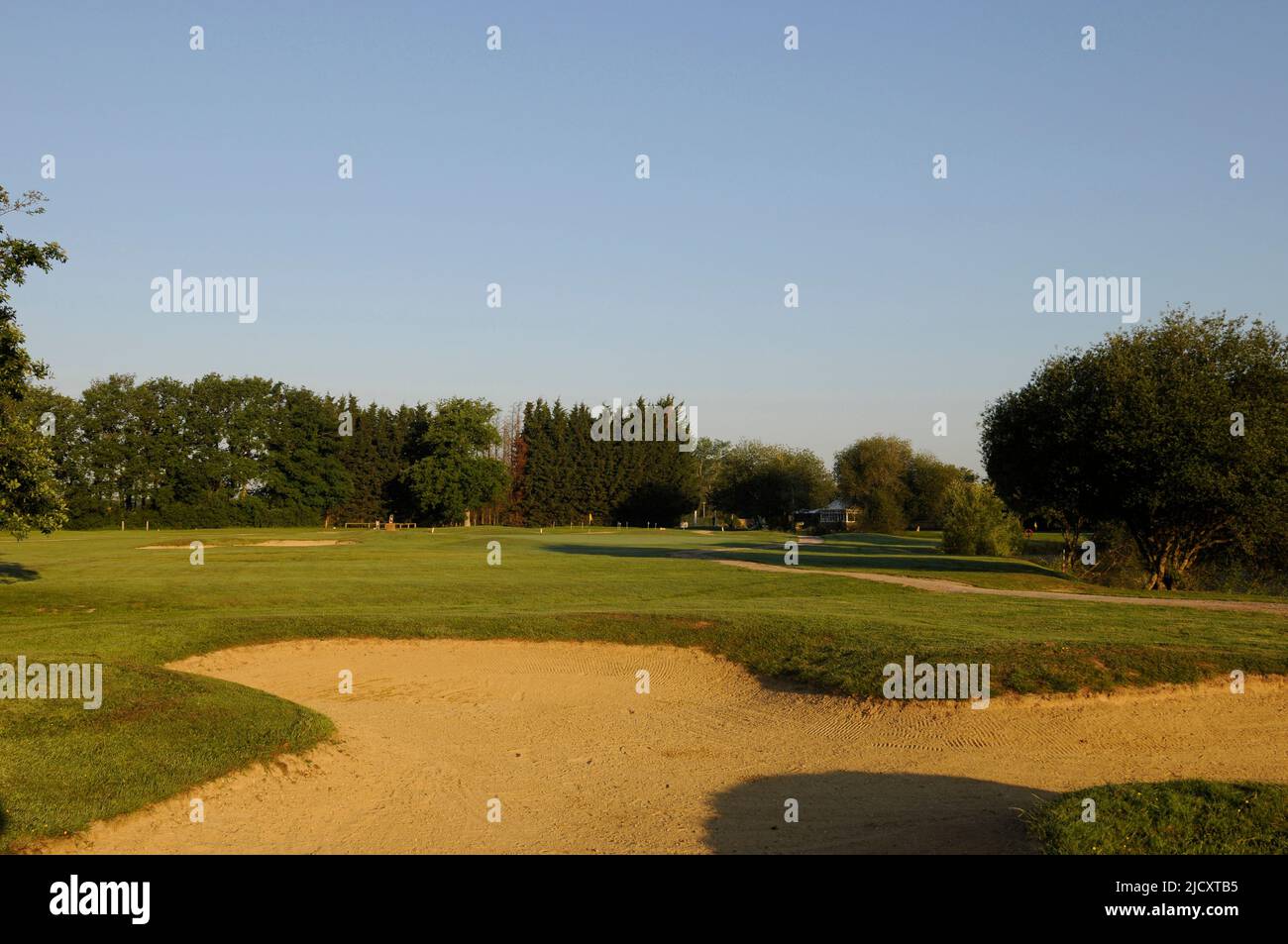 View over Fairway bunker to 9th Green, Horne Park Golf Club, Horne, South Godstone, Surrey, England Stock Photo