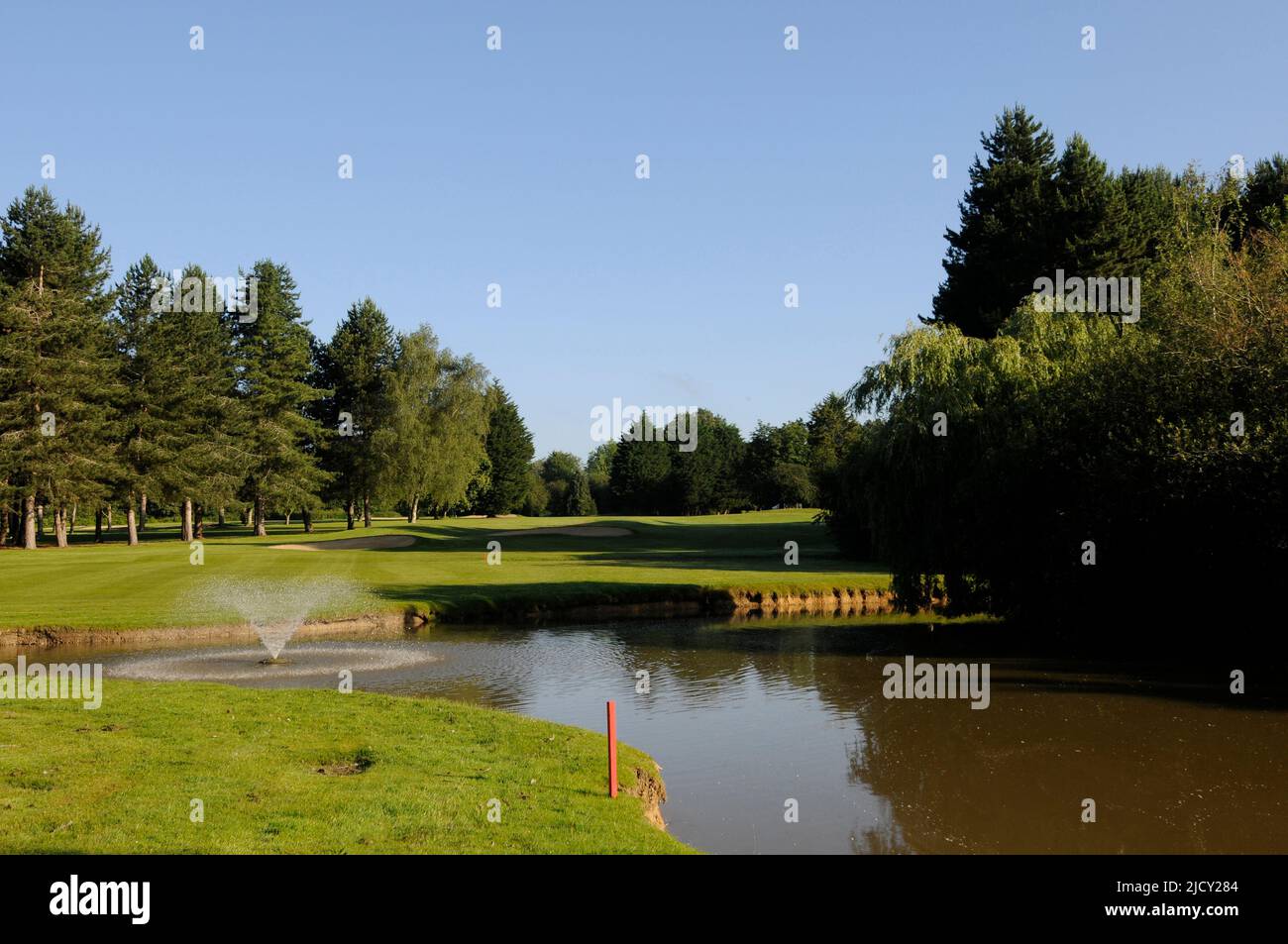 Early Morning view over Pond to 4th Green, Bentley Golf Club, Brentwood, Essex, England Stock Photo