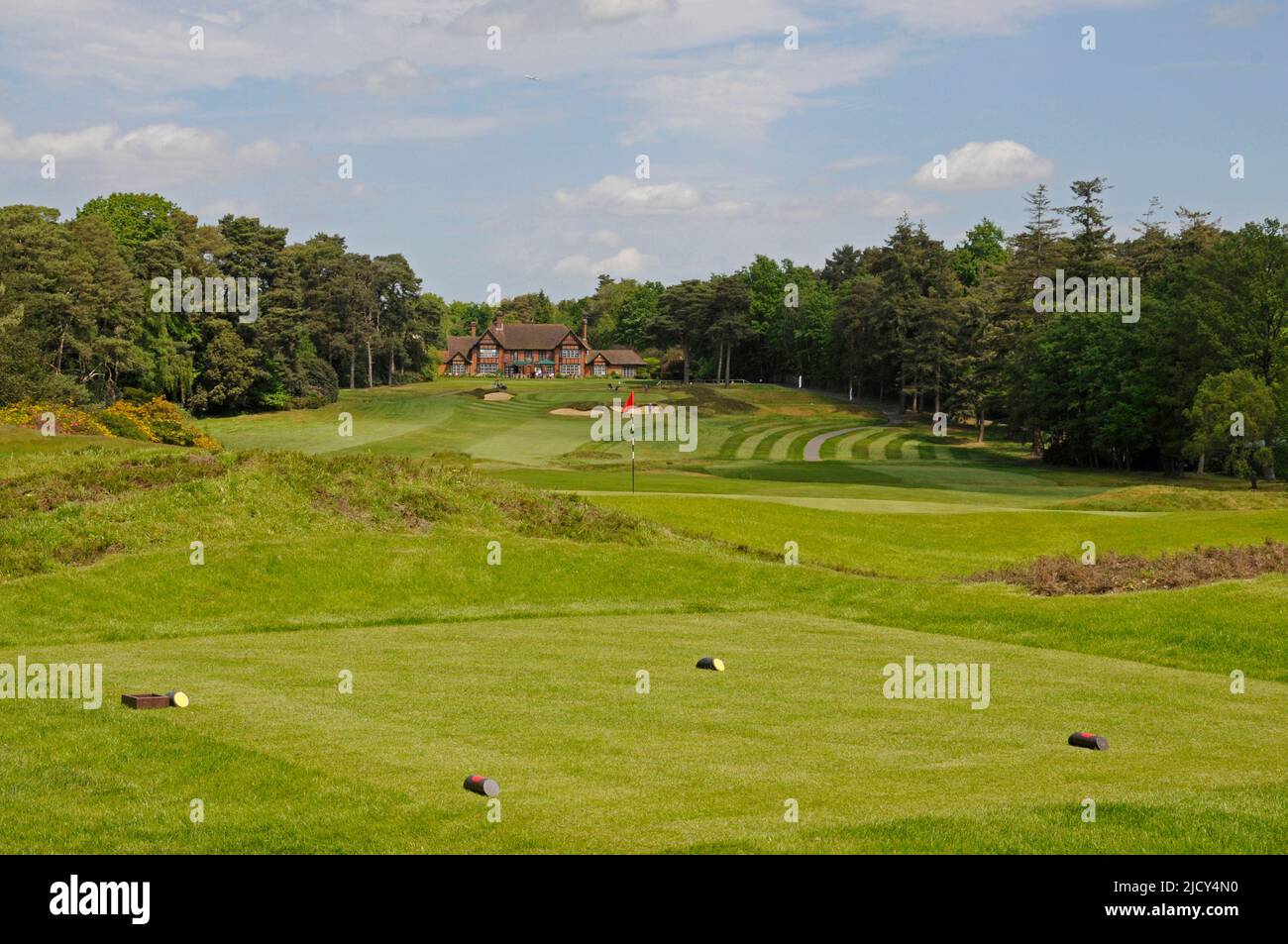 View over 2nd tee to 1st Green and 18th Hole with Clubhouse in background, Swinley Forest Golf Club, Ascot, Berkshire, England Stock Photo