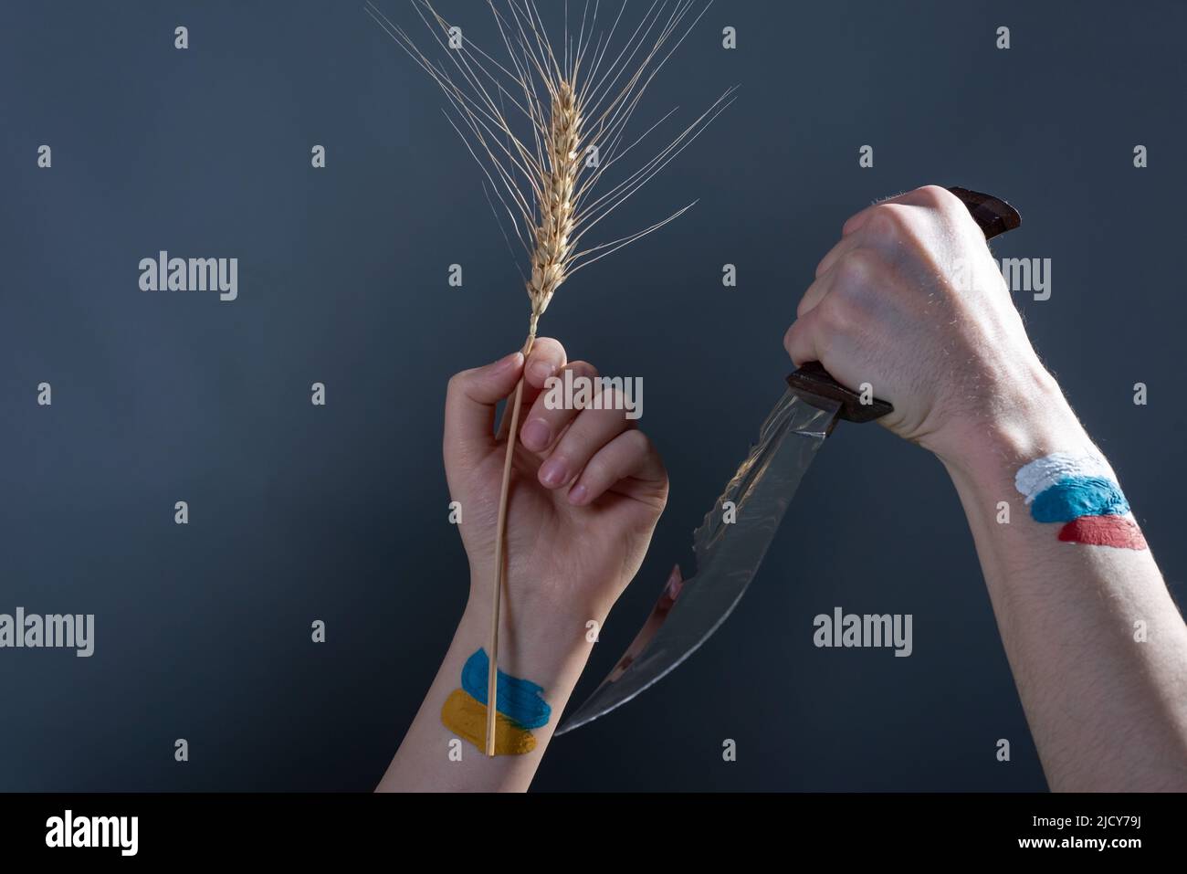russia vs ukraine concept russia threatens with a knife Stock Photo