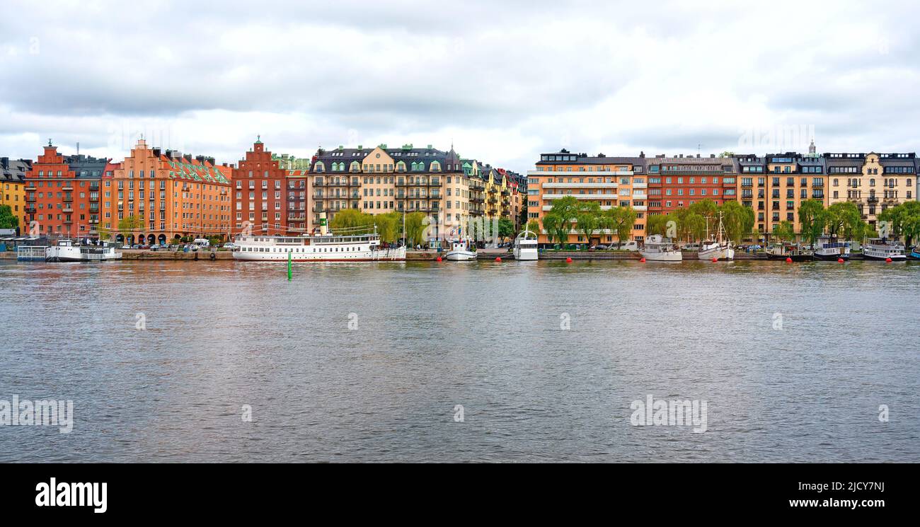 house facades and boats on the embankment of Mälarstrand in Stockholm, Sweden Stock Photo