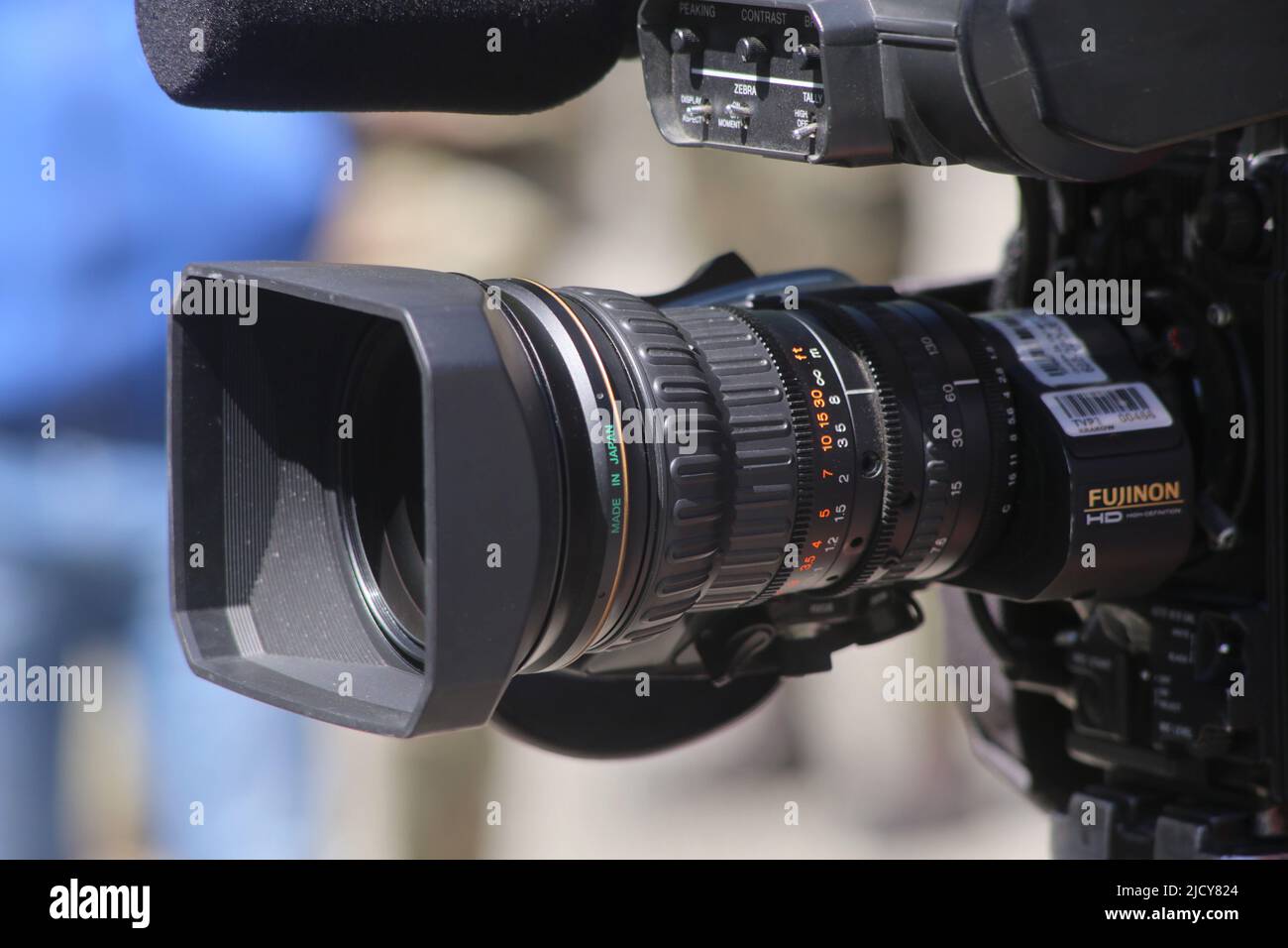 TV professional video camera lens - detail. Manual focusing. Stock Photo