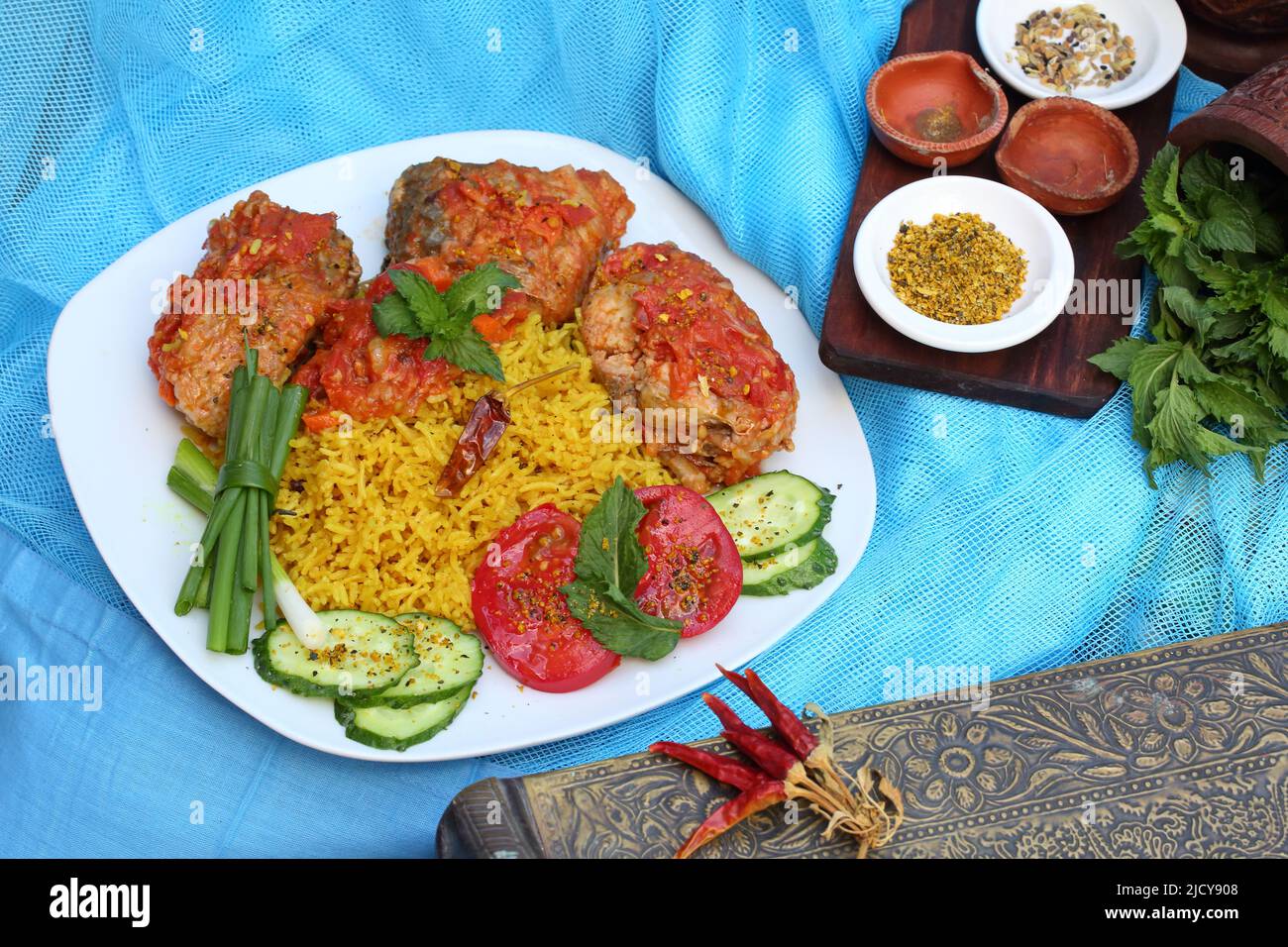 Fried fish in tomato sauce with basmati rice. Indian food Stock Photo