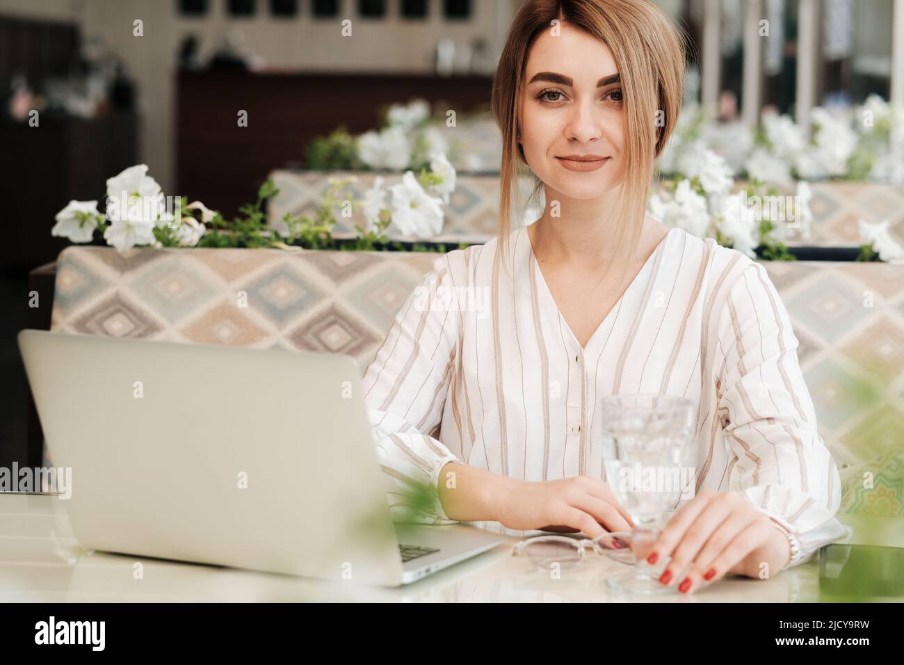 Confident Young Woman Looking Straight Into Camera, Female Working on ...
