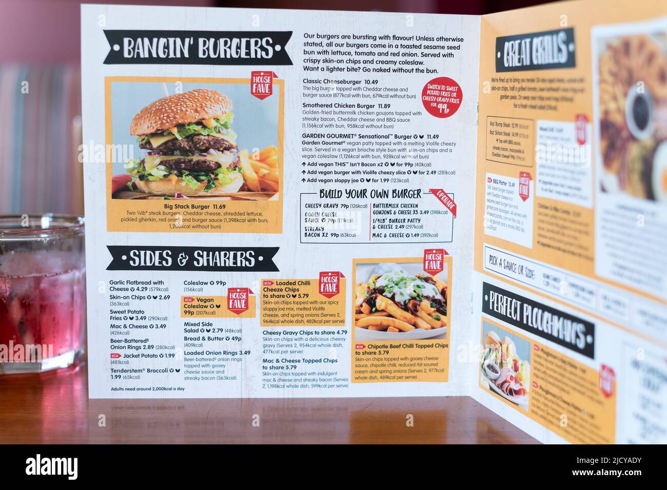 A menu card from a Brewers Fayre restaurant in the UK. The menu clearly shows the calorific value for each menu food item for those calorie counting Stock Photo