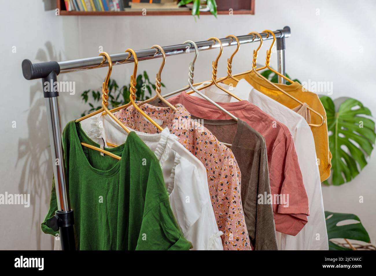 Secondhand clothes on the rail. The concept of sustainable economic