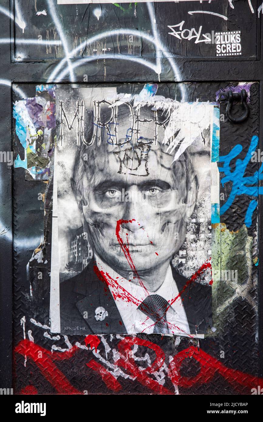Torn Putin skull poster in Nolita district of New York City, United States of America Stock Photo