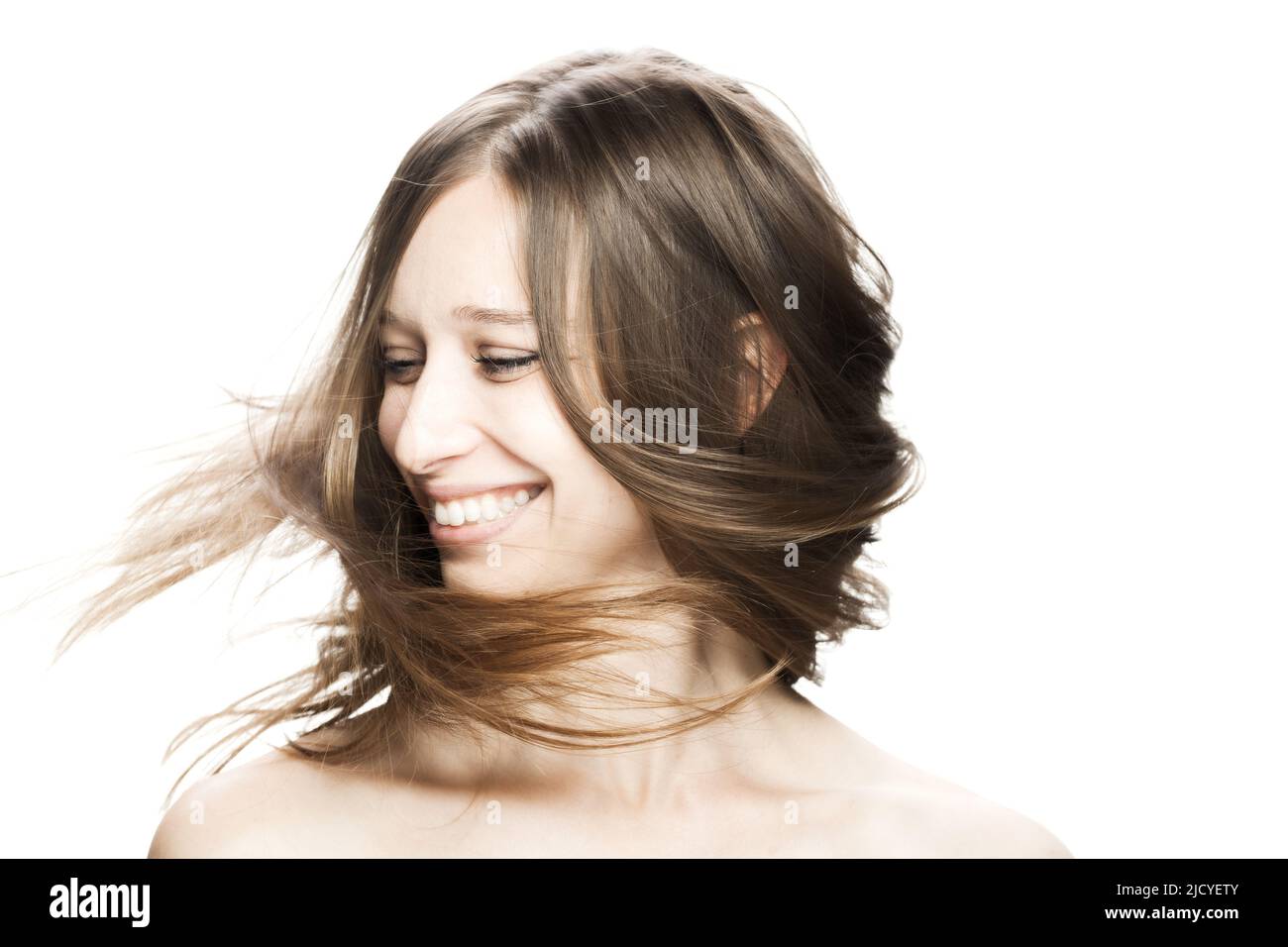 girl with flowing hair in the air studio portrait against