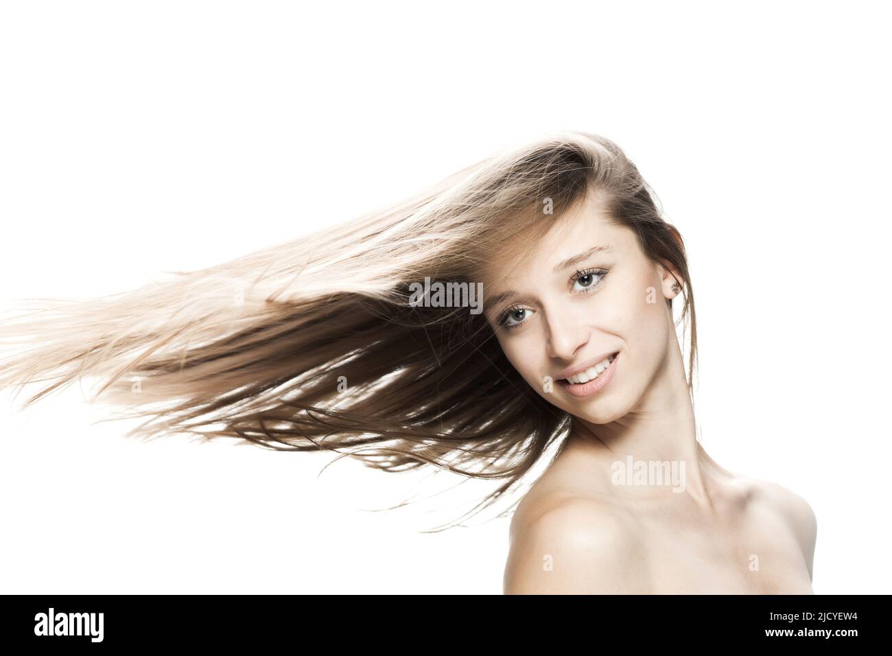 girl with flowing hair in the air studio portrait against