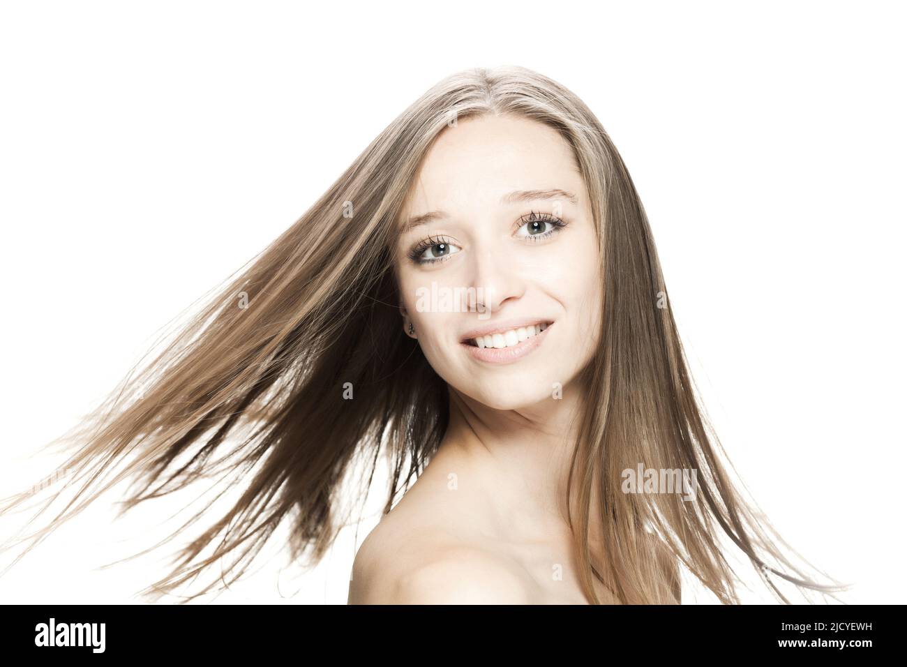 girl with flowing hair in the air studio portrait against