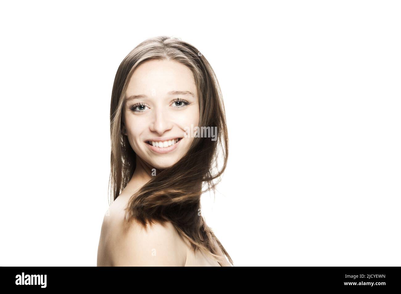 girl with flowing hair in the air studio portrait against