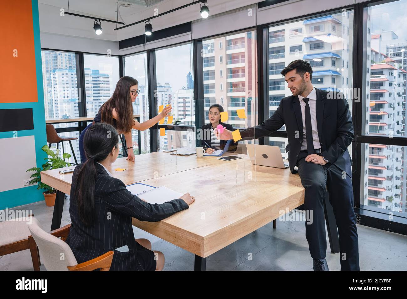 Brainstorming Partition Multiethnic creative group of business people brainstorming and using ...