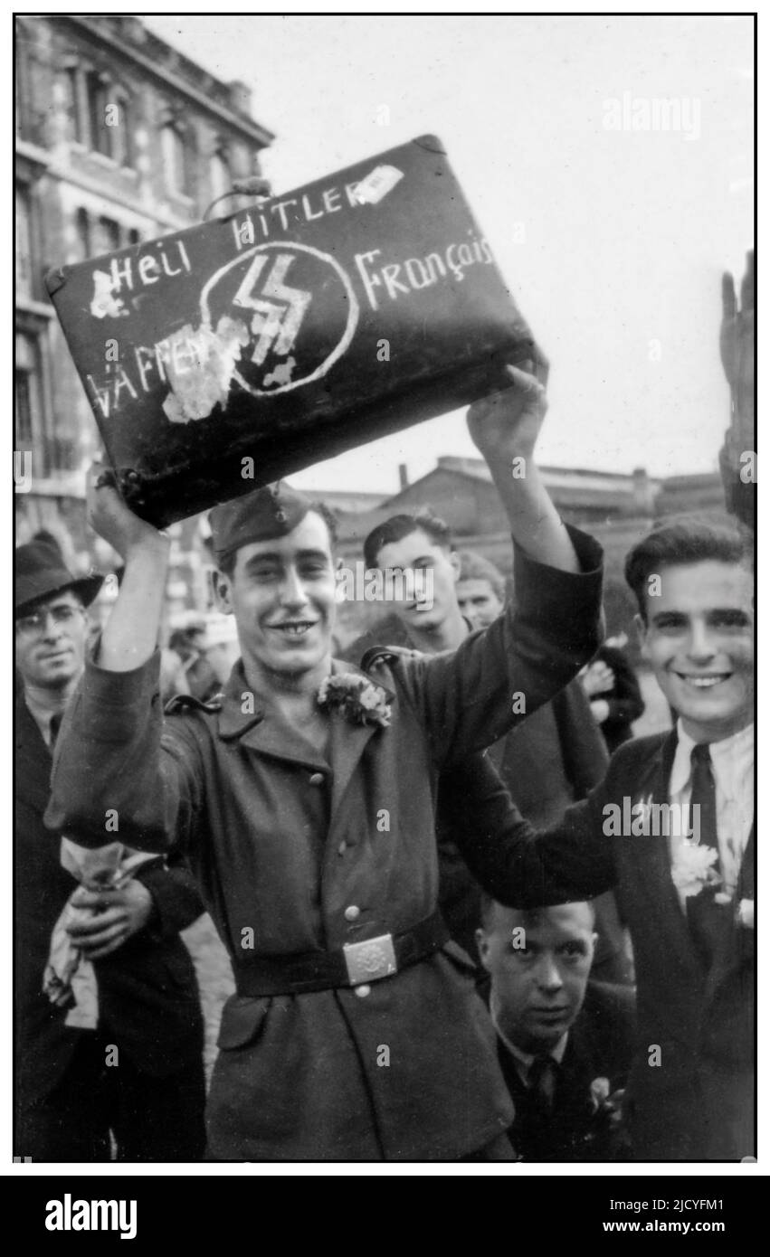 VICHY FRANCE Nazi Propaganda image in occupied France showing a French Waffen SS Soldier holding aloft a suitcase with 'HEIL HITLER WAFFEN SS FRANCAIS  French recruit for the SS-Volunteer Sturmbrigade France departing from Paris in October 1943 1940s Occupied Vichy France 1943 Stock Photo
