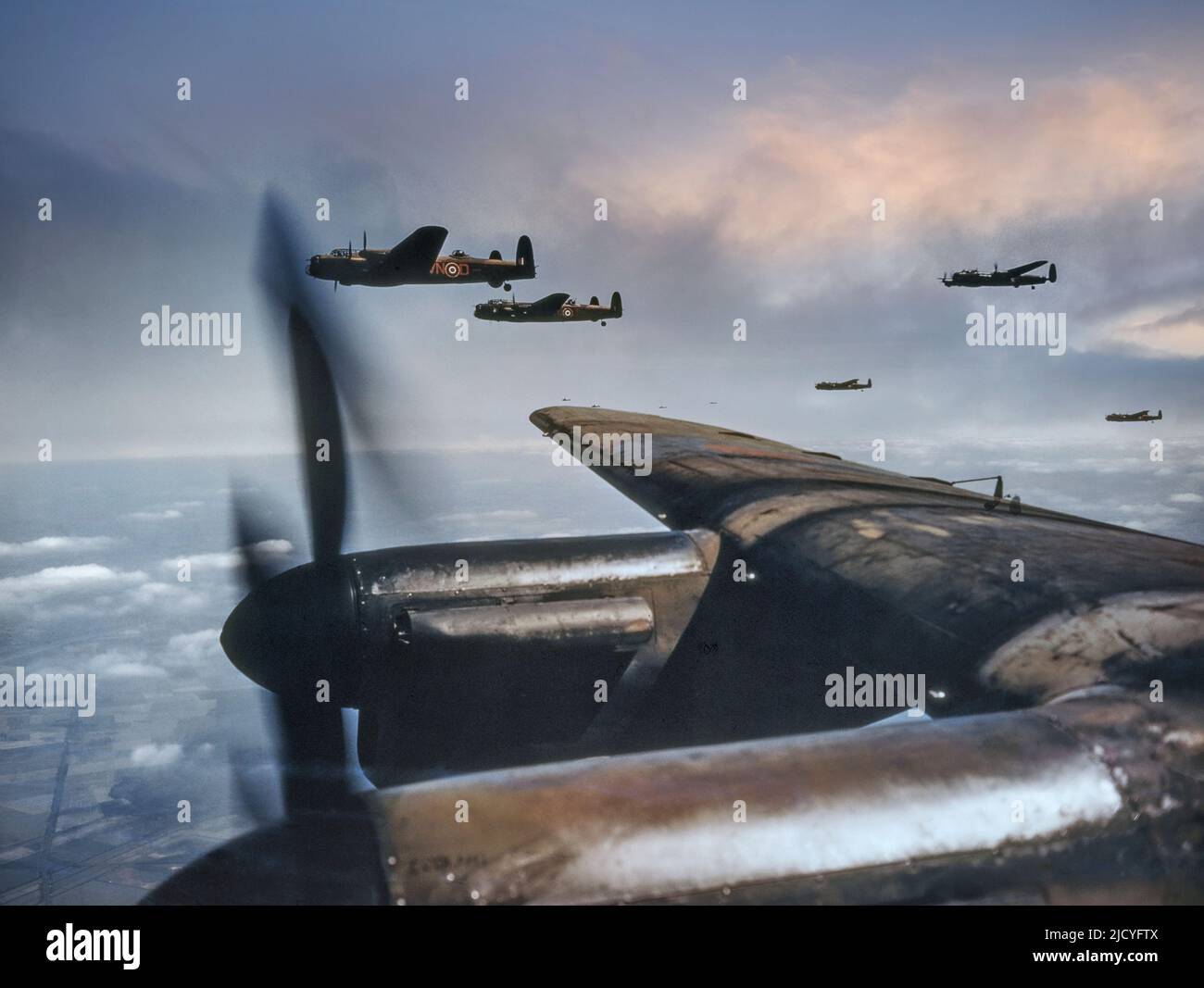 LANCASTER BOMBERS FORMATION BOMBING RUN 1940s WW2 WAR Bomber Command with Avro Lancaster Bombers in-flight en route to Nazi Germany August 1943 No. 50 Squadron, Royal Air Force, based at Skellingthorpe, flying in spread formation. World War II Second World War Great Britain UK Stock Photo