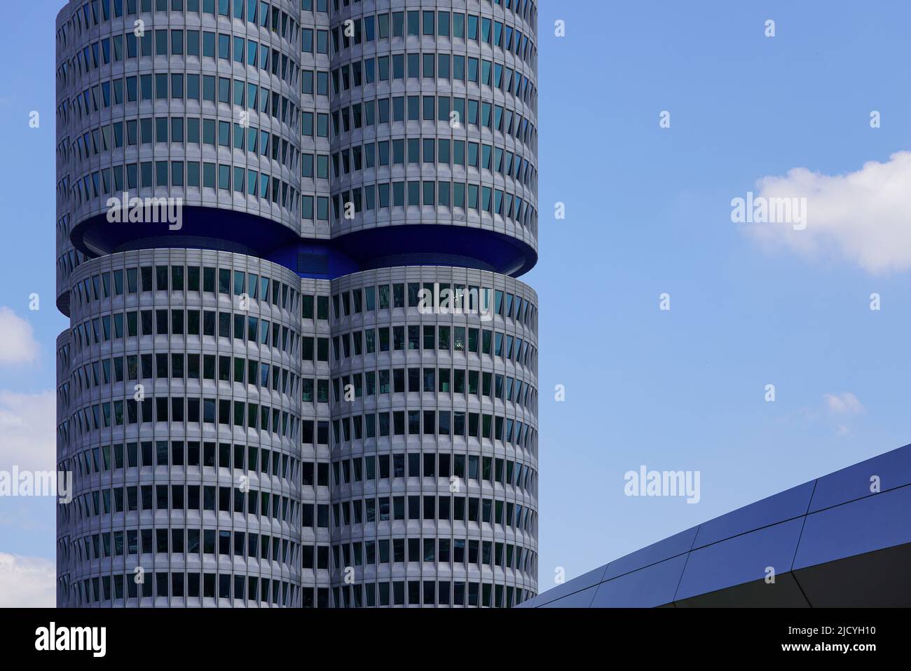 The BMW Tower, the BMW four-cylinder is the main administration building and landmark of the car manufacturer BMW in Munich, Germany, 9.5.22 Stock Photo