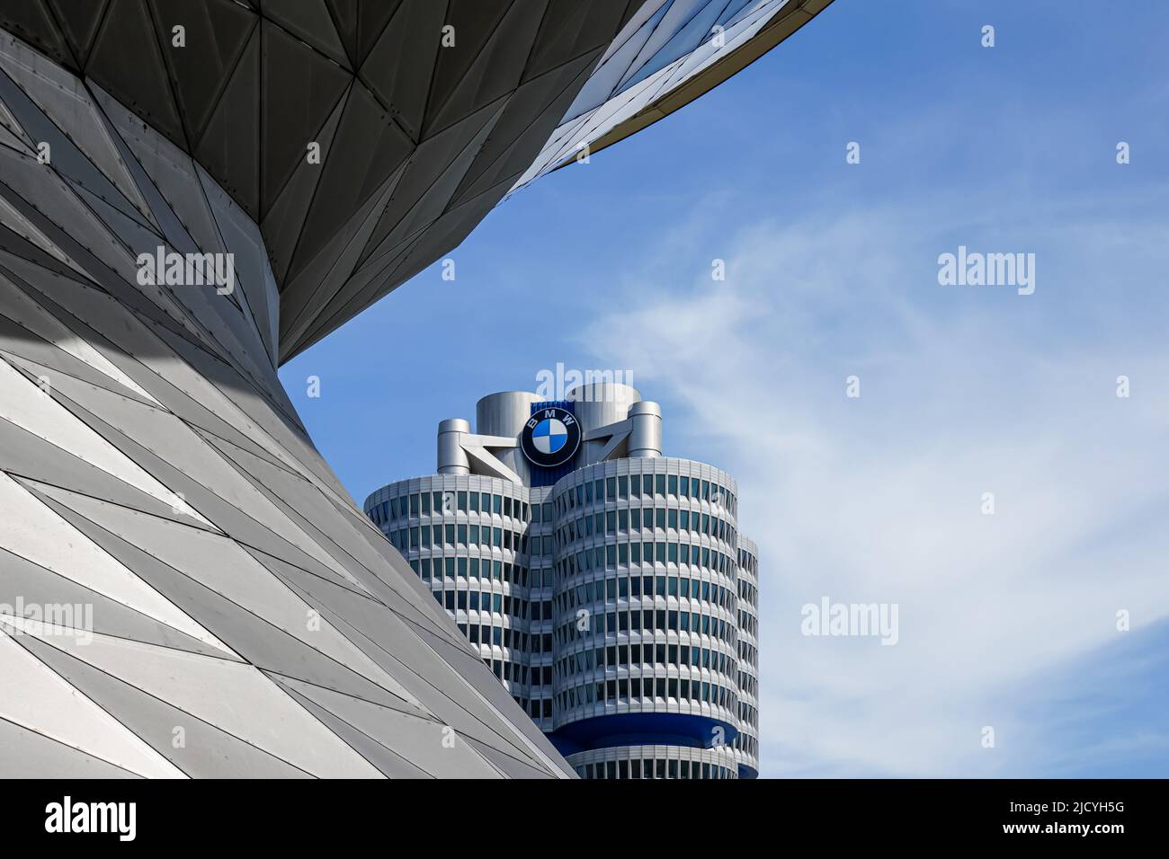 The BMW Tower, the BMW four-cylinder is the main administration building and landmark of the car manufacturer BMW in Munich, Germany, 12.4.22 Stock Photo
