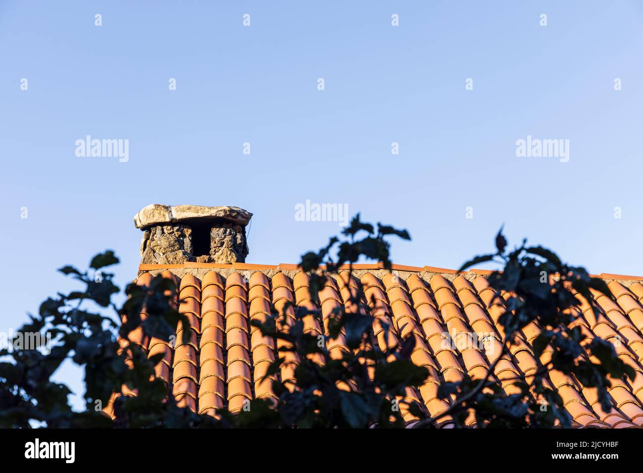 Roof detail with red tiles and stone walls, Rural hotel, Caserio Los Partidos, El Tanque, near Santiago del Teide in Tenerife, Canary Islands, Spain Stock Photo