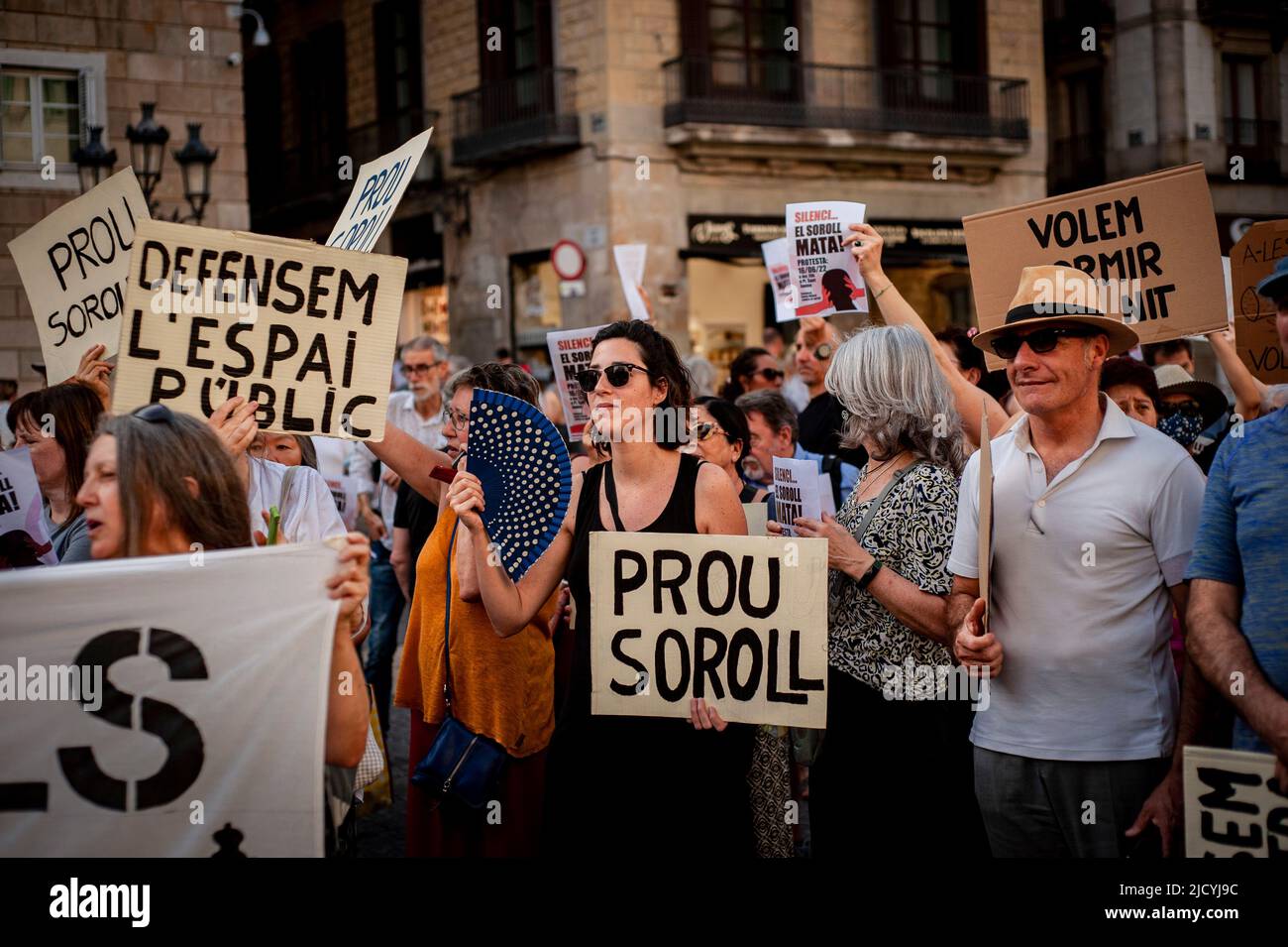 Barcelona residents hold placards reading Stop Noise as they gather to protest against noise pollution affecting nightlife areas and  neighbourhoods under mass tourism influence. Stock Photo
