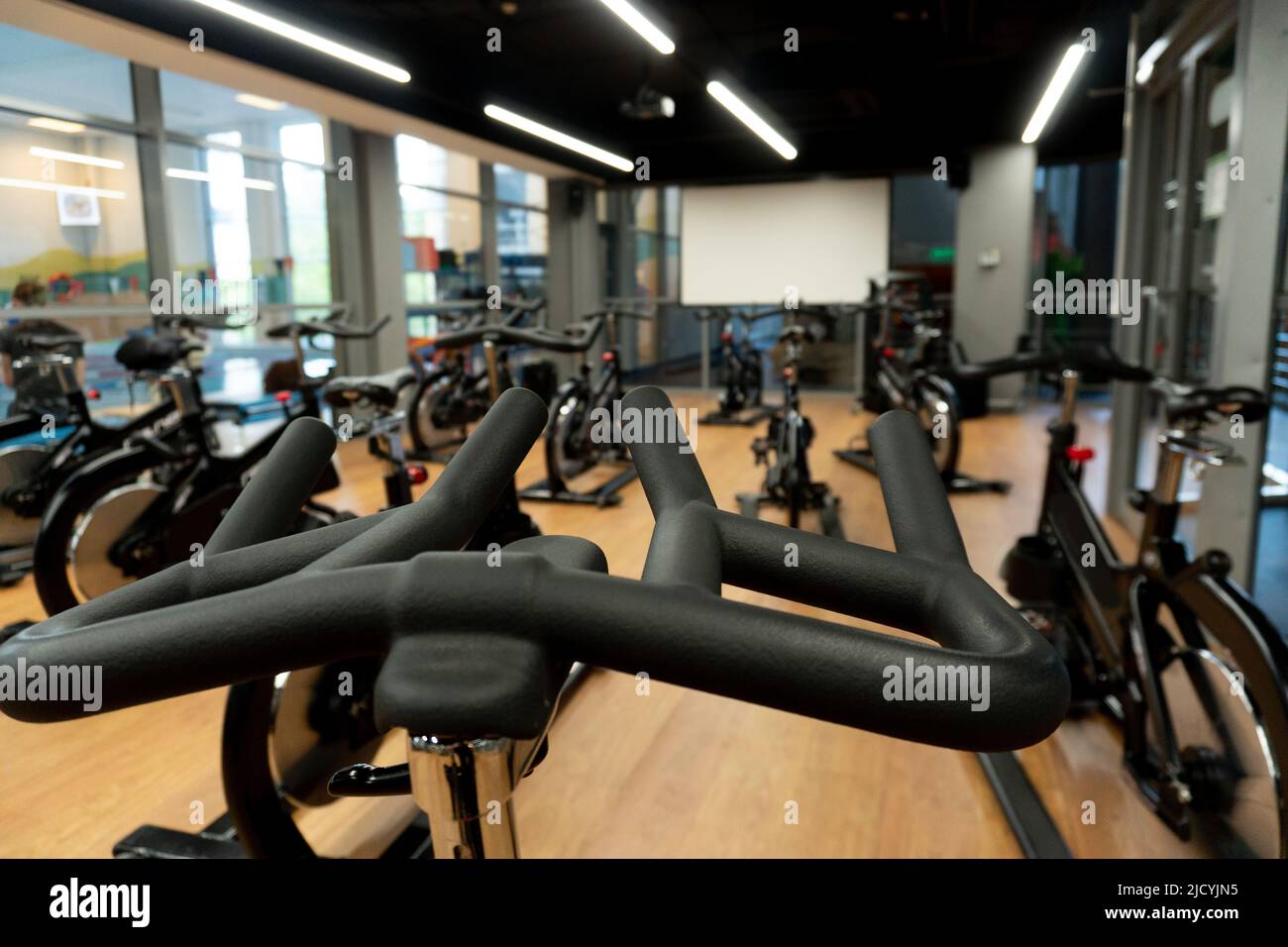 Group gym bike wheel exercise cardio fitness workout slim aerobic, concept loss sport from equipment from endurance sportswoman, power stationary Stock Photo
