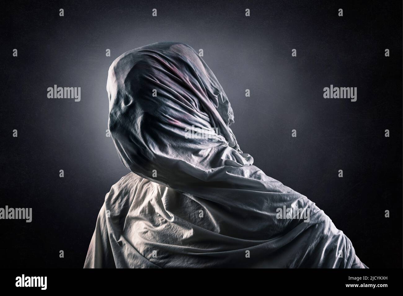 Portrait of a scary ghost over dark misty background Stock Photo