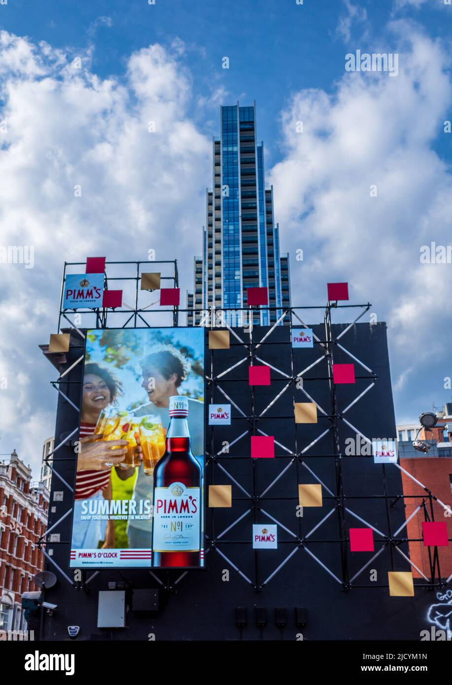 Pimms Advert in Shoreditch London - innovative electronic advertising hoardings near East London Tech City on Silicon Roundabout. Stock Photo