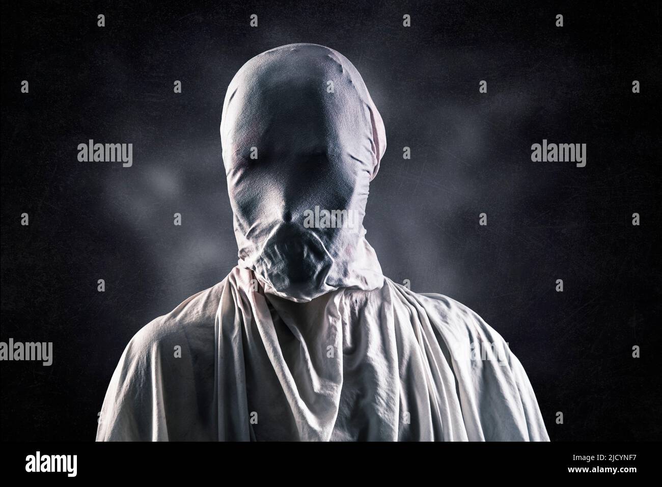 Portrait of a scary ghost over dark misty background Stock Photo
