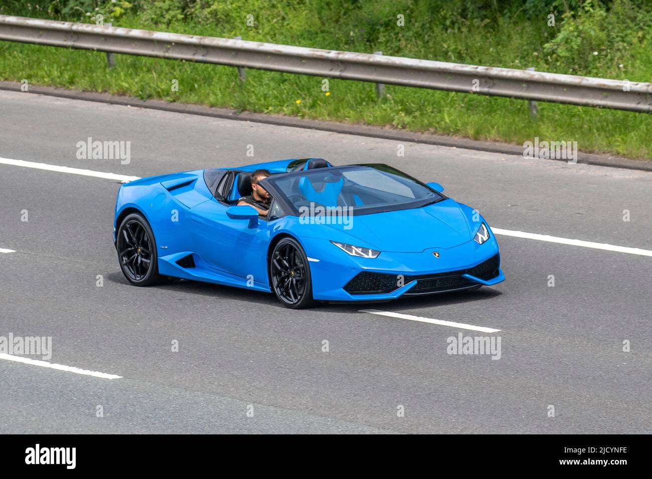 Lamborghini Aventador, blue (Blu Seiler) SVJ 770 horsepower; driving on the M6 Motorway, Manchester, UK Stock Photo