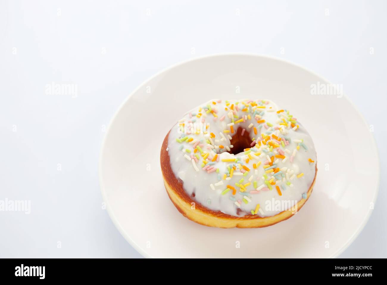 frosted doughnut isolated on white background Stock Photo