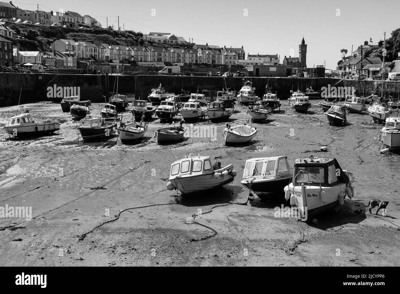 Black and White images of fishing craft in Porthleven Inner Harbour at Low Tide Stock Photo