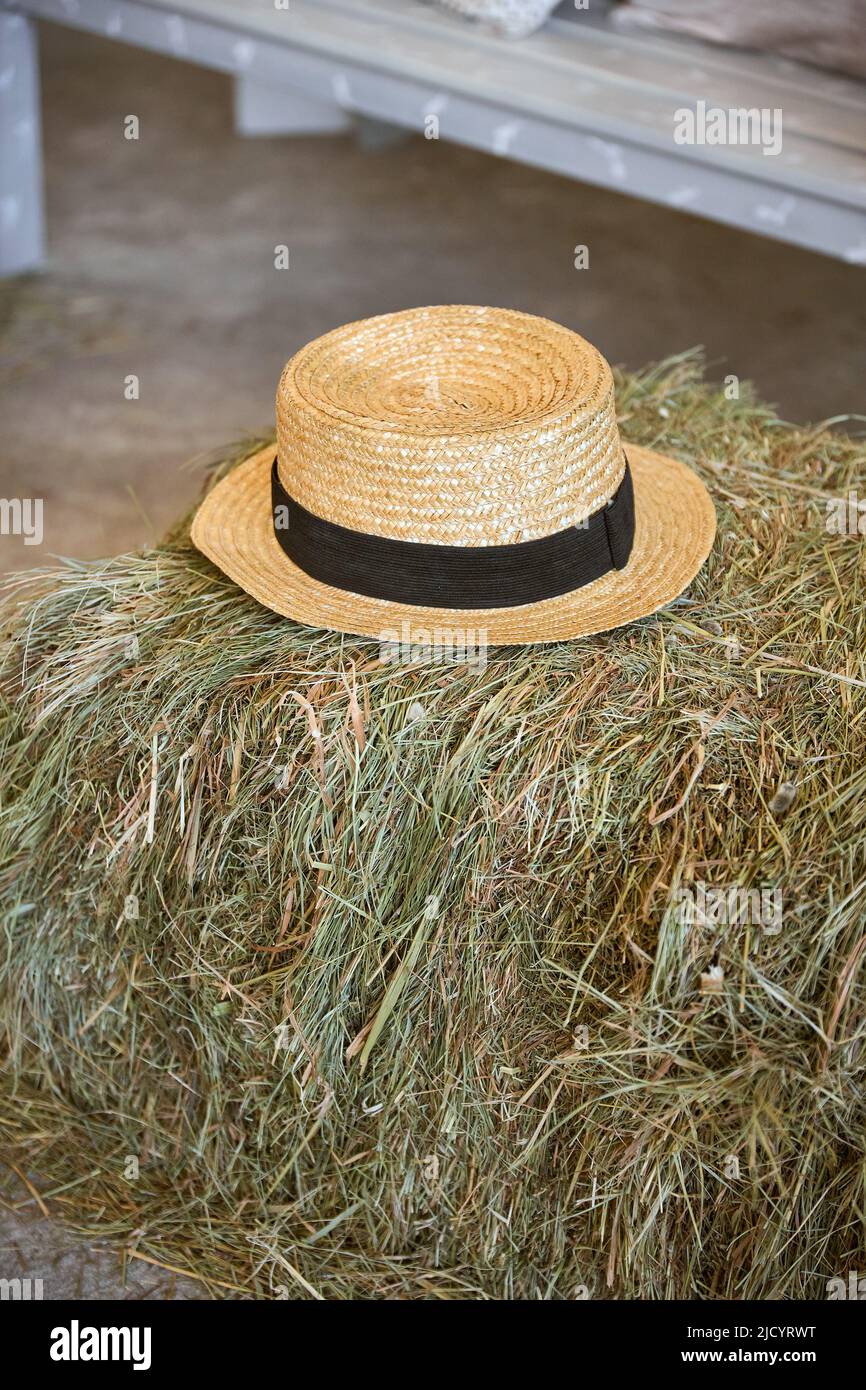 A beige hat lies on a haystack Stock Photo