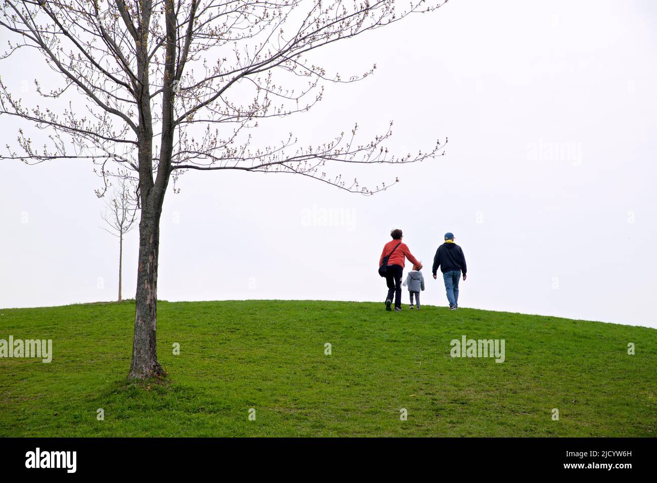Family walking in the public park. A healthy lifestyle. Stock Photo