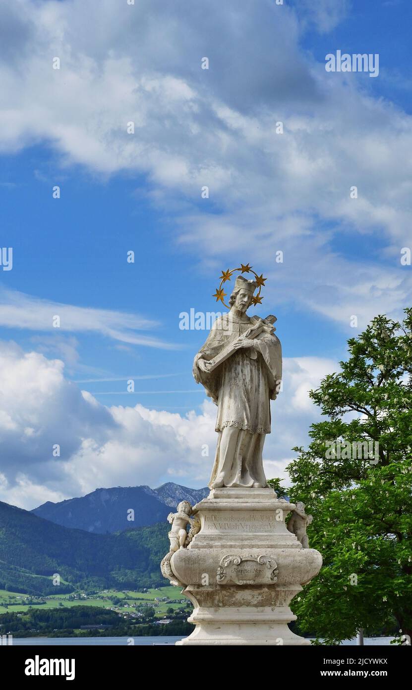 Statue of John of Nepomuk at lake Traunsee, Gmunden, Austria, vertical Stock Photo