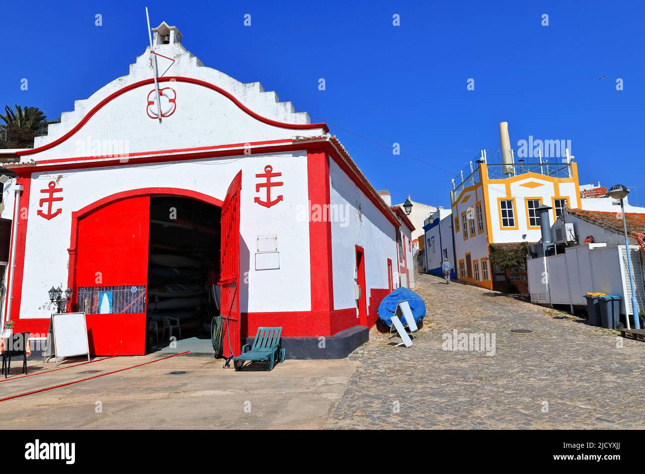 Cobbled Rua Vasco da Gama Street housing the ancient lifeguard station. Alvor Portimao-Portugal-341 Stock Photo