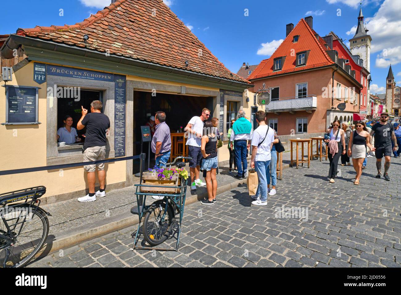 Würzburg, Germany - June 2022: Shop selling wine to go to tourist at famous Old Main bridge Stock Photo