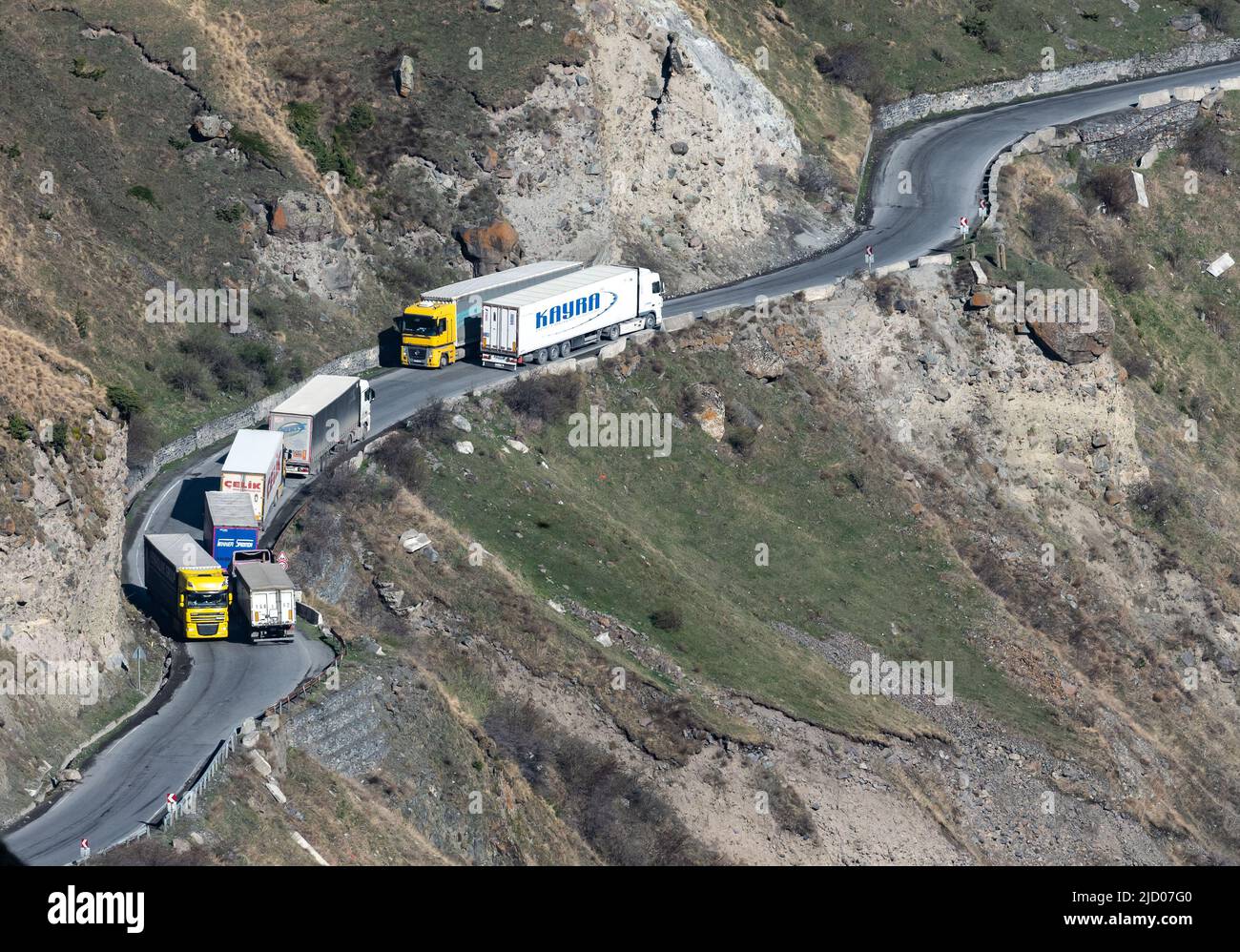 Heavy traffic of trucks on the Military Highway connecting Georgia and Russia. Stock Photo