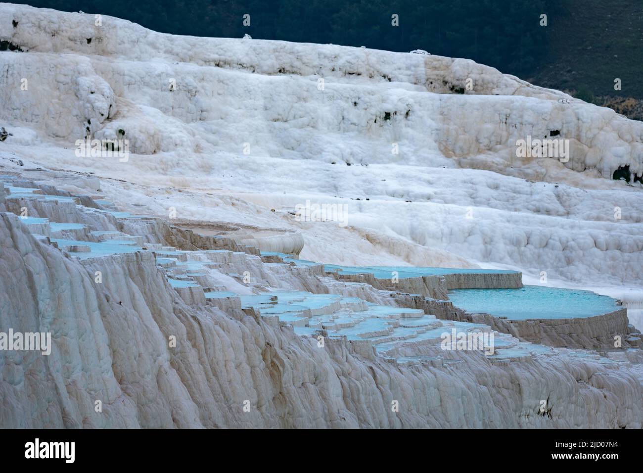 White Carbonate deposits from thermal springs on the Travertine Terraces. Pamukkale,. Türkiye. Stock Photo