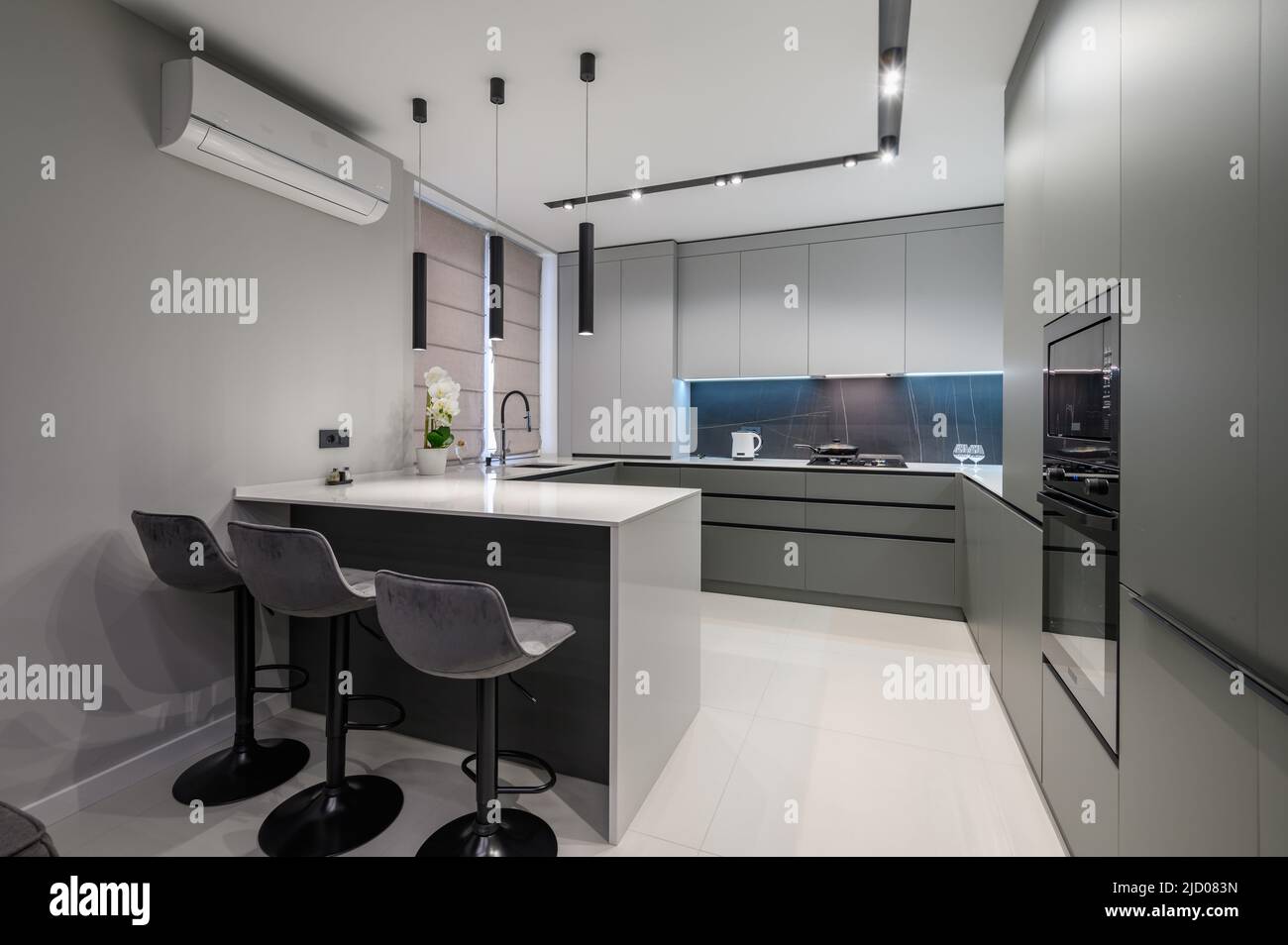 Luxury dining room and kitchen in studio apartment Stock Photo - Alamy