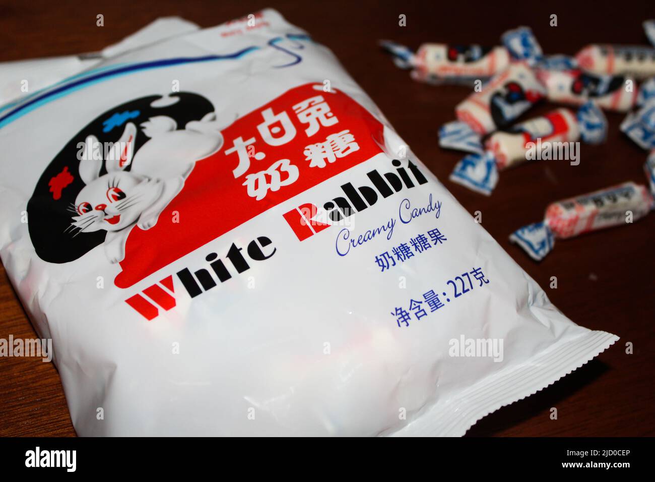 Side view of White Rabbit Creamy Candy which is a brand of milk candy manufactured by Shanghai Guan Sheng Yuan Food, Ltd., in China. Famous candy. Stock Photo
