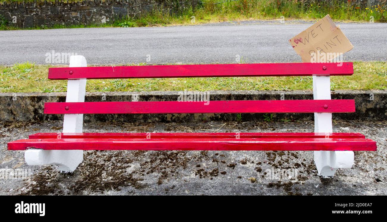 Wet Paint sign on Park Bench Stock Photo