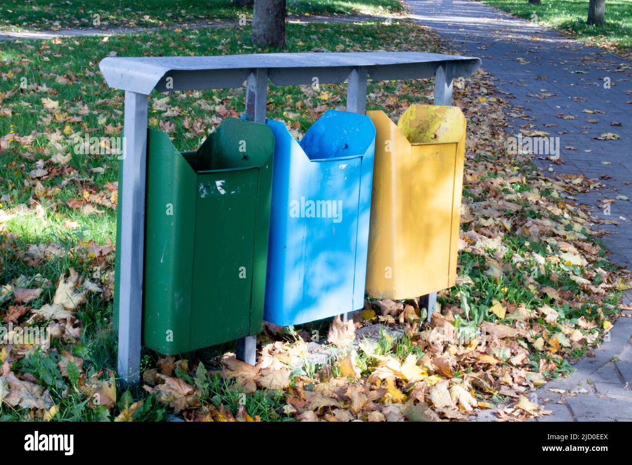 Different Colored Bins For Collection Of Recycle Materials Stock Photo
