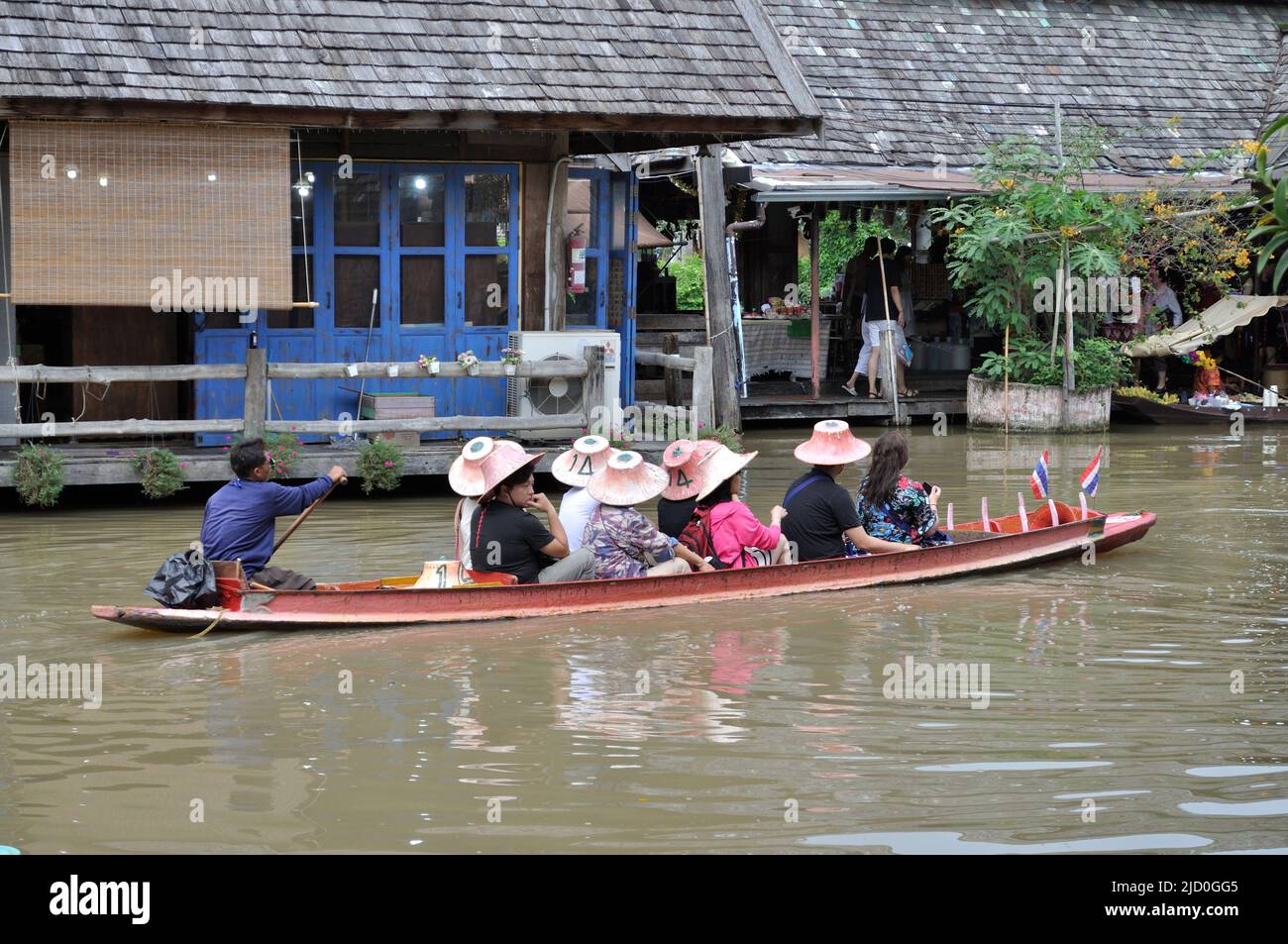 Tourists in boat on the waters of the Floating Market - Pattaya, Thailand. Stock Photo
