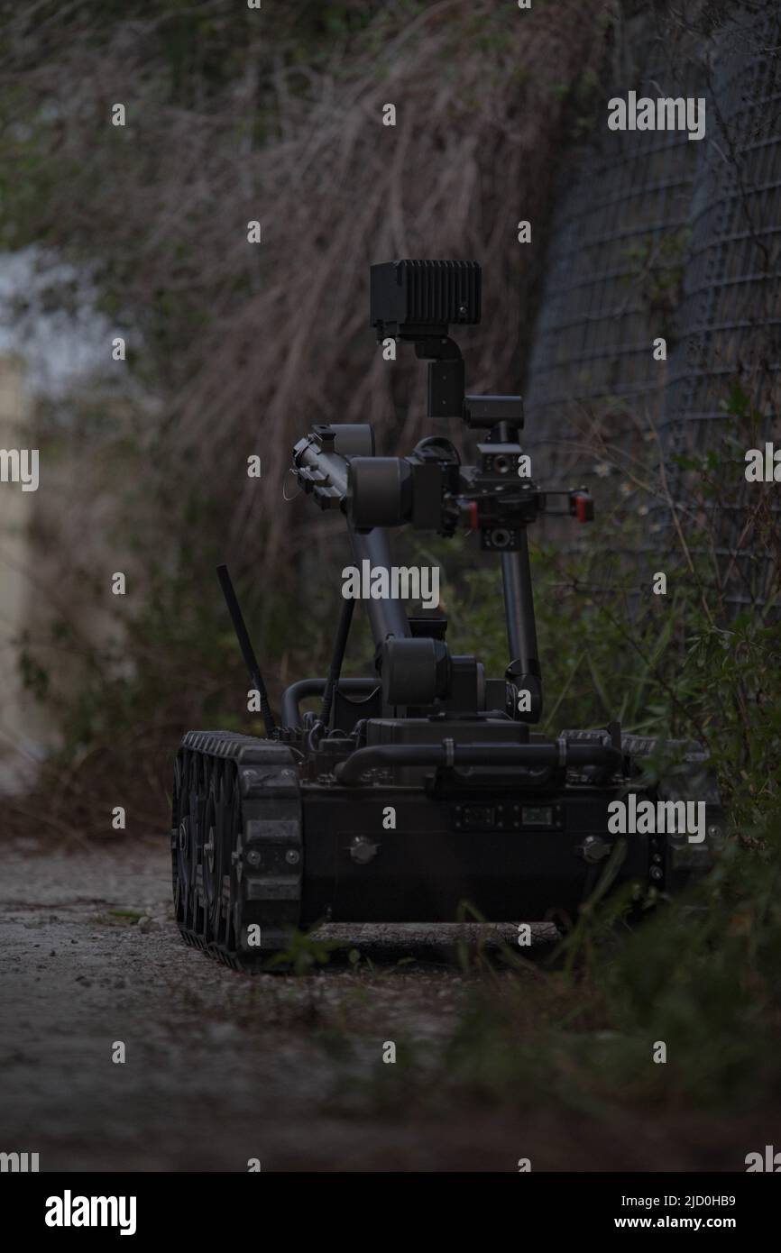 A U.S. Sailor drives a bomb disposal robot (BDR) to an objective during ...