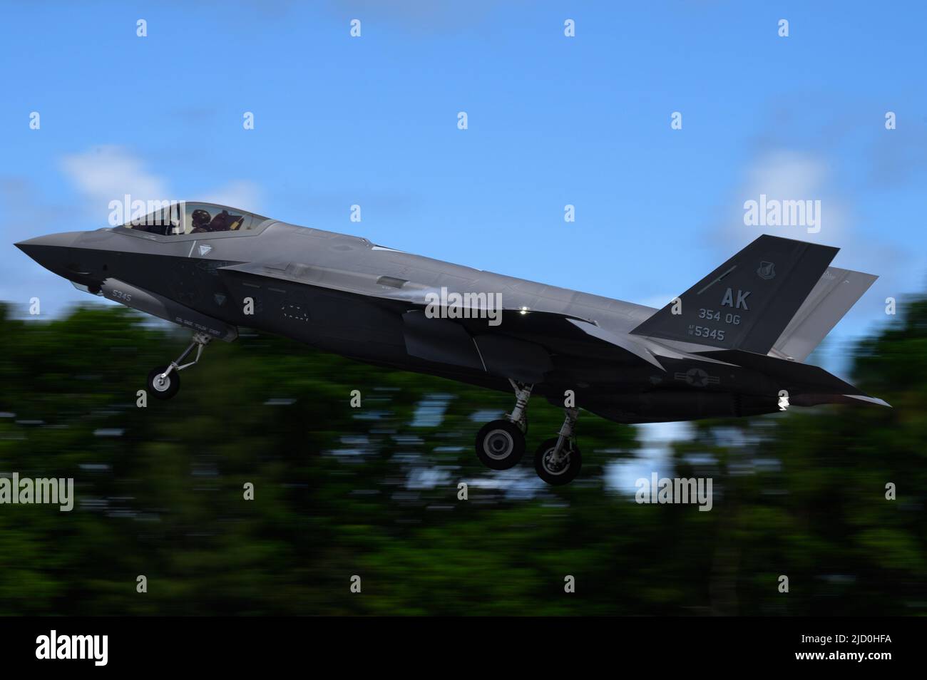 A U.S. F-35A Lightning II assigned to the 356th Expeditionary Fighter Squadron, 354th Air Expeditionary Wing takes off from Palau International Airport in support of Valiant Shield 22, June 12, 2022. VS22 is a U.S.-only, biennial field training exercise focused on integration of joint training in a multi-domain environment. This training builds real-world proficiency in sustaining joint forces through detecting, locating, tracking and engaging units at sea, in the air, on land and in cyberspace in response to a range of mission areas. (U.S. Air Force photo by Senior Airman Jose Miguel T. Tamon Stock Photo