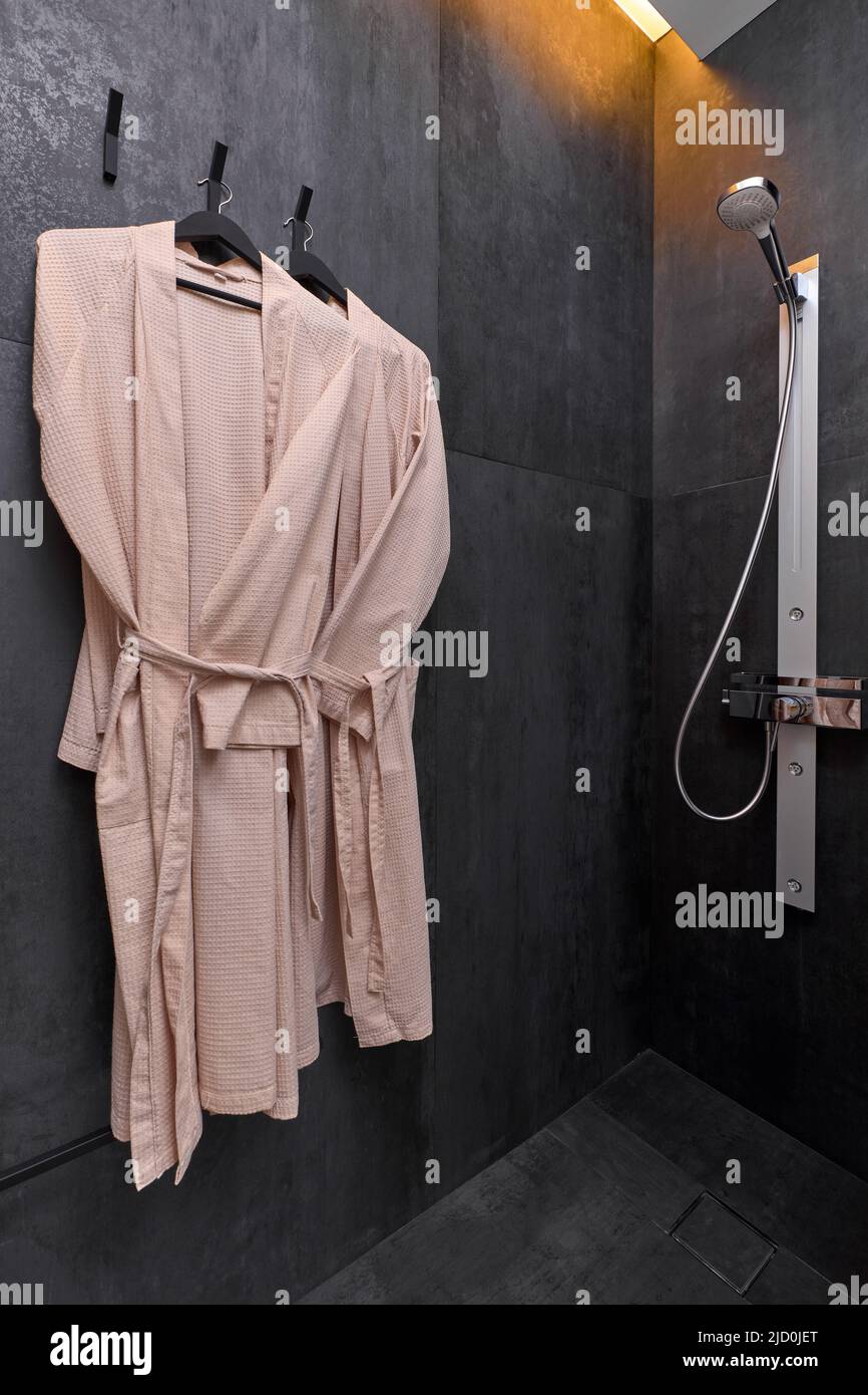 A shower stall with two hanging towels  Stock Photo