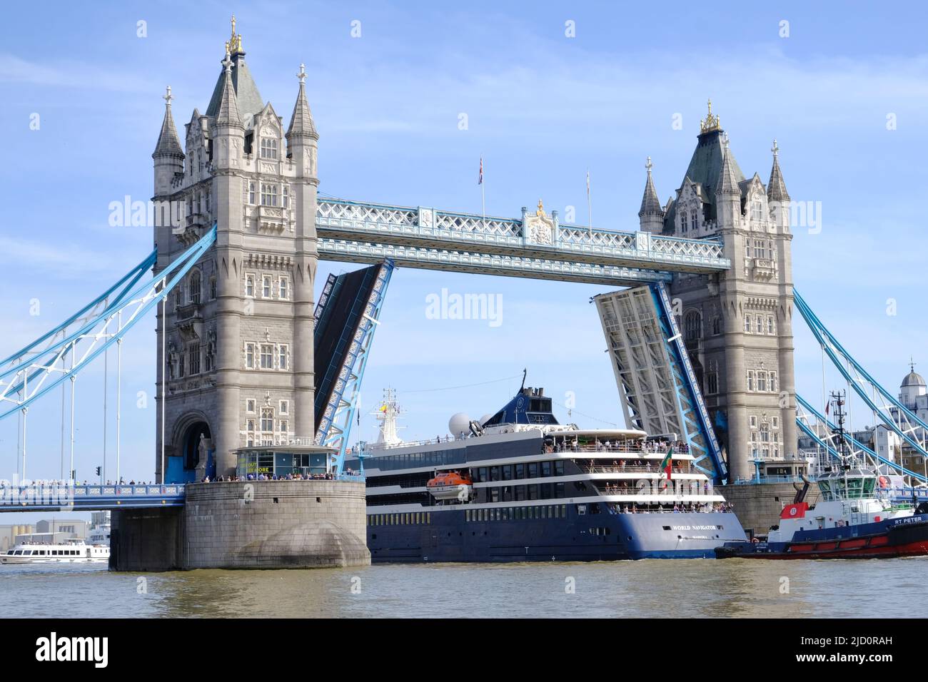 London, UK. The Navigator cruise ship passes through Tower Bridge on ...