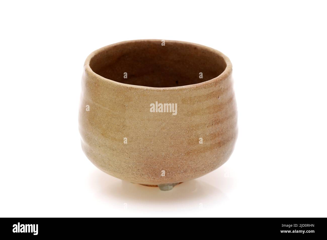 Single tea bowl used in Japanese matcha tea ceremony on white background Stock Photo