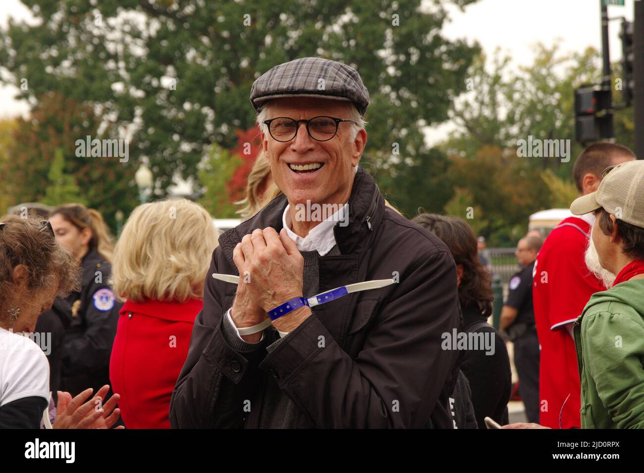 Actor Ted Danson stands under arrest at a Fire Drill Fridays climate change protest near the US Capitol on 25 October 2019. Stock Photo