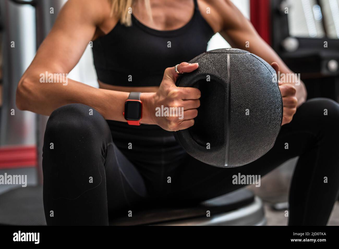 Close up on midsection of unknown caucasian woman female athlete hands ...