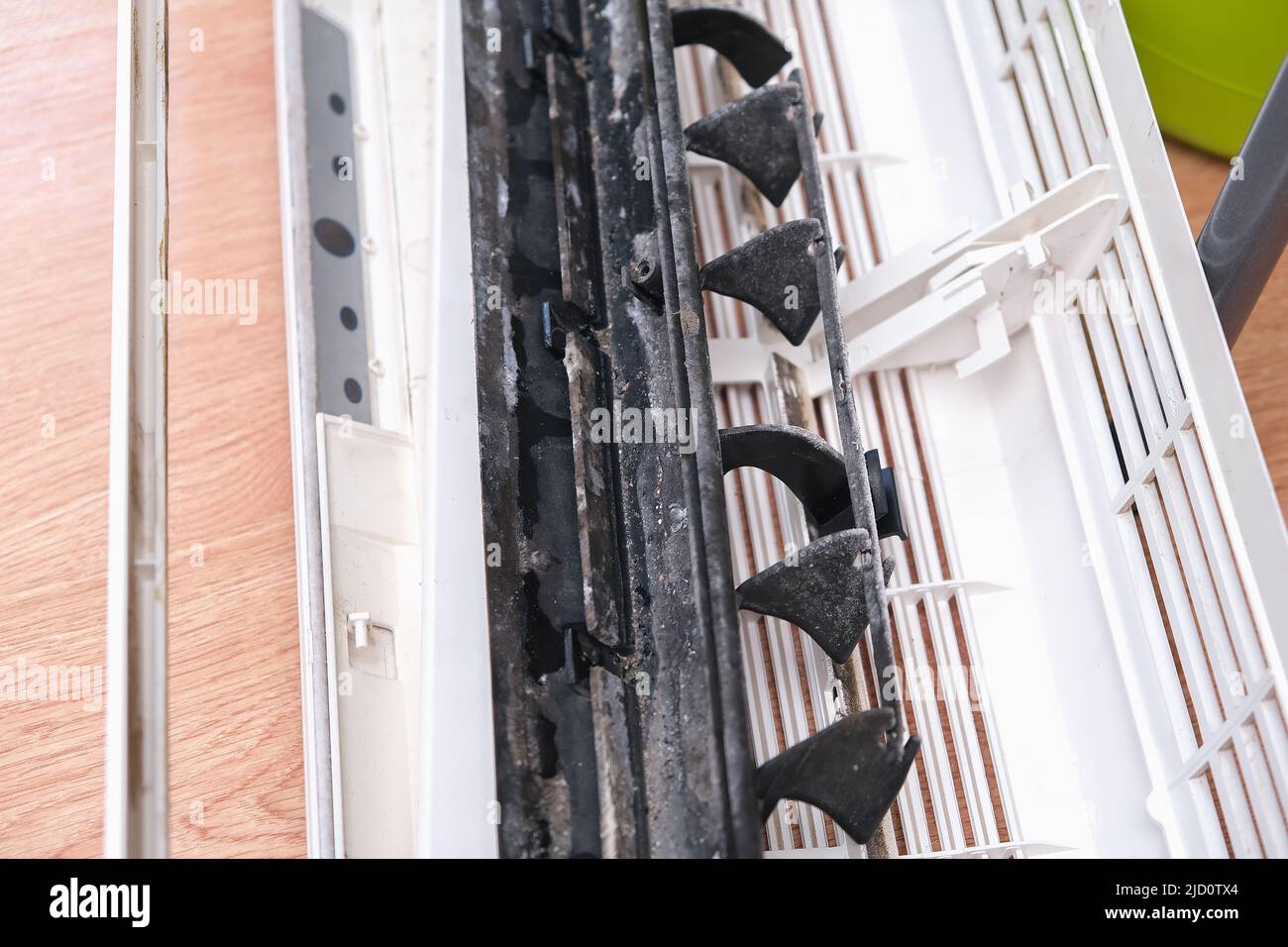 Mold and dust on the air conditioner body. Maintenance and cleaning of